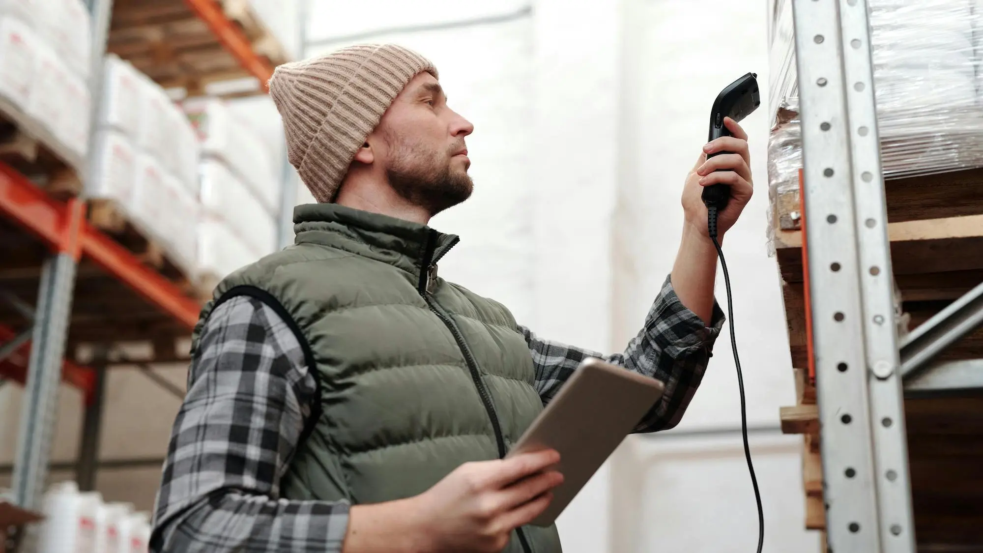 Man doing inventory management with a scanner.